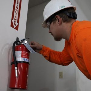 fire extinguisher inspector, inspecting a fire extinguisher, tagging fire extinguisher
